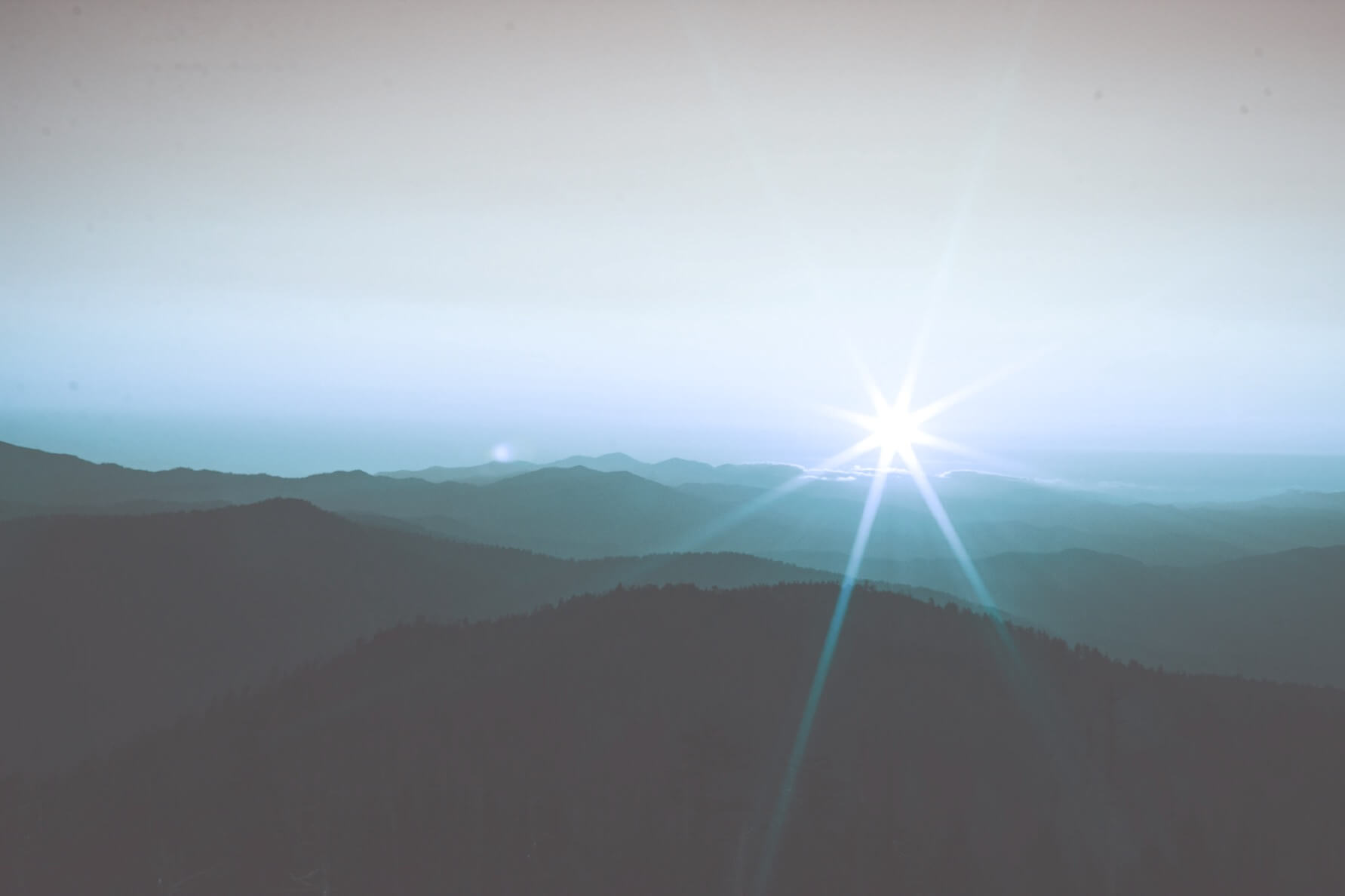 Light behind mountain landscape